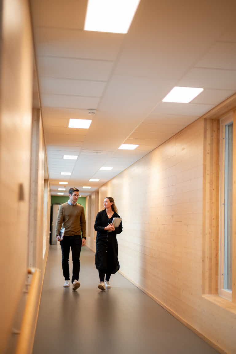 People walking in a corridor