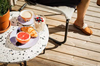 Our impregnated premium decking on a sunny balcony. 