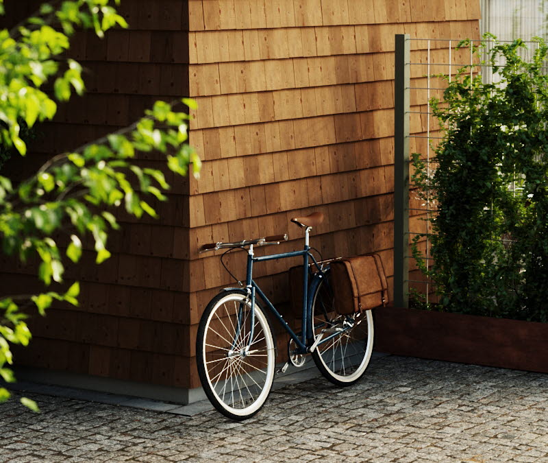 Ett flerfamiljshus klädd med SCAs fasadspån. En cykel står lutad mot fasaden.