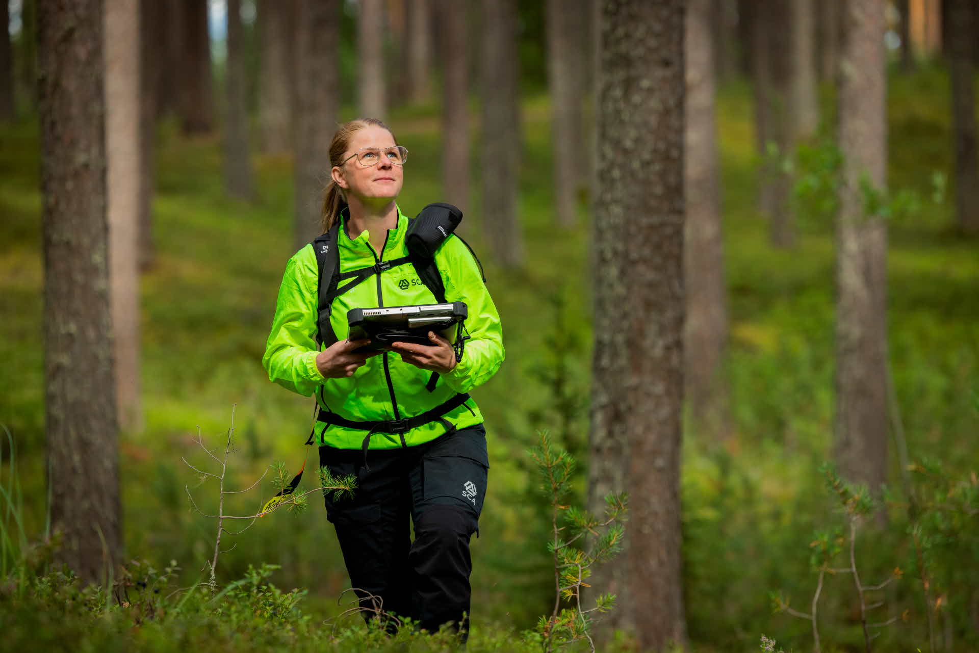 A woman walking in the forest.