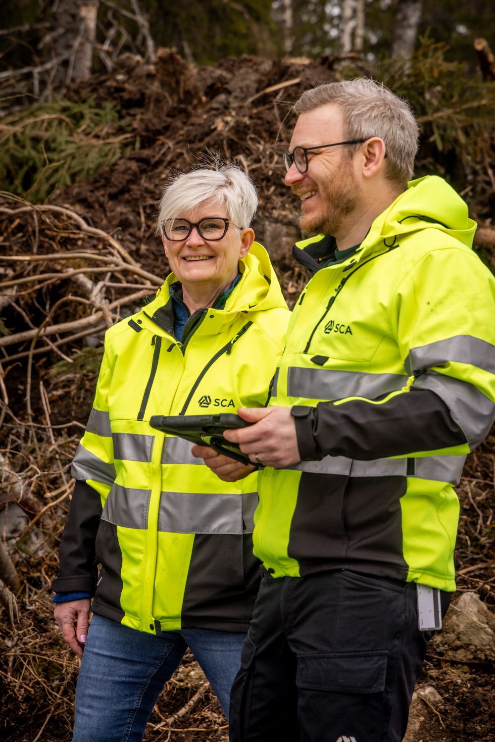 Two people planning in the forest