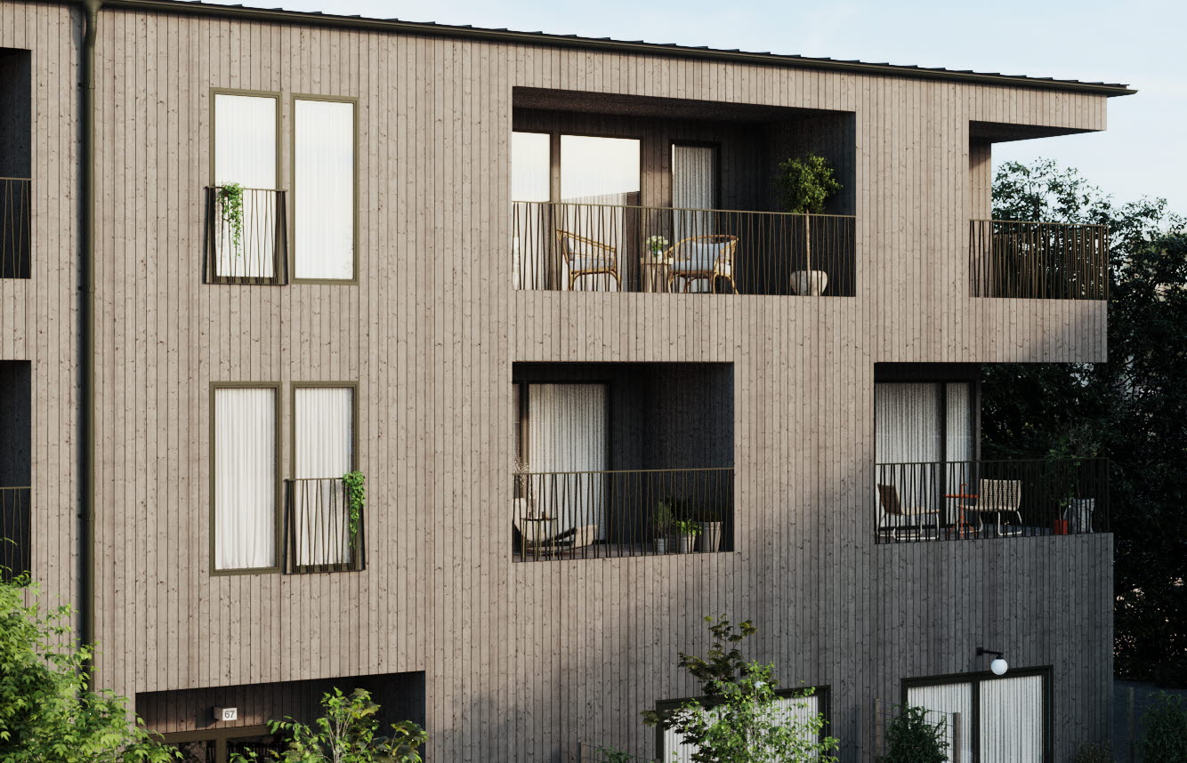 Et flerfamiliehus kledd med grånet kledning i malmfuru fra SCA.