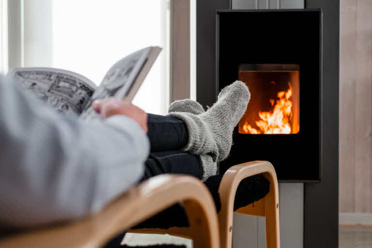 reading in front of av pellets stove