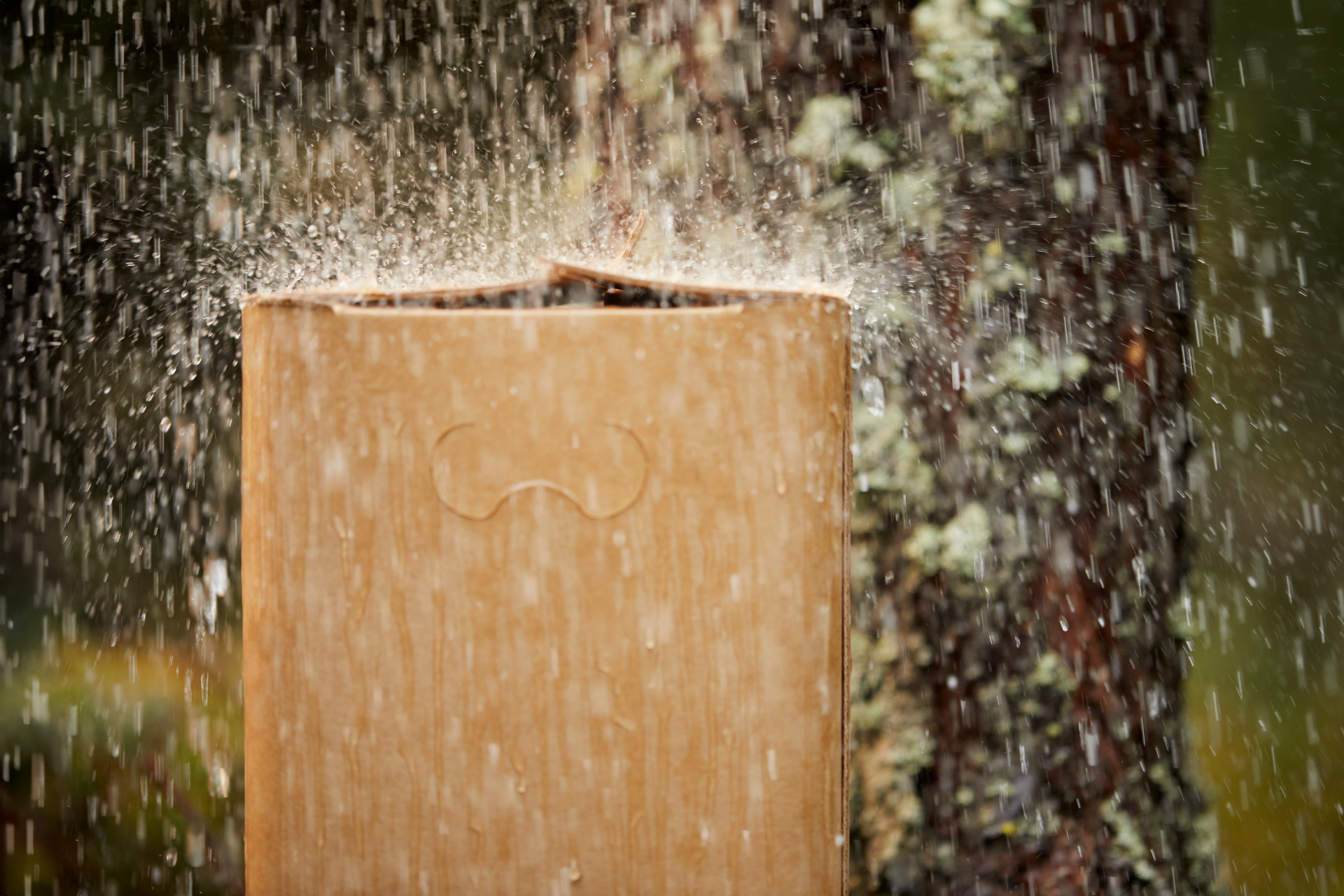 Corrugated cardboard box in heavy rain